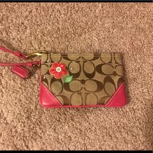 Pink Coach monogram wristlet